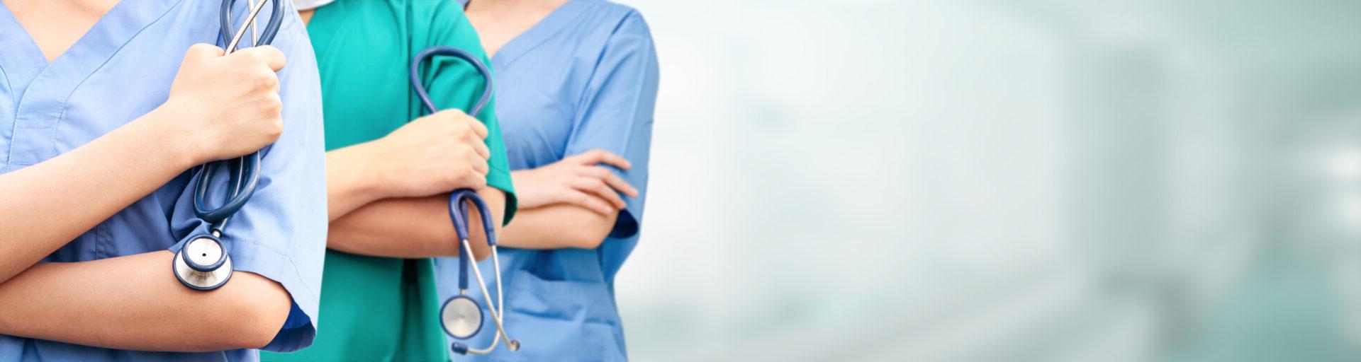 Nurses holding medical equipment